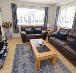 A living room with a sofa and coffee table at 6 Westview in Embleton