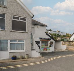An outdoor view of an ice cream kiosk at Harbour Studio in Sennen Cove