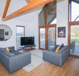 A living room with sofas and a TV at Lodge 1 South Hykeham