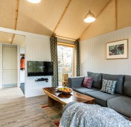 A living room with a sofa and coffee table at Lodge 17 in Corfe Castle