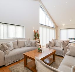 A living room with sofas and a coffee table at Bilsham Meadows, Aust