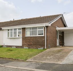 A semi detached house with a garage and driveway at 17 Ffordd Gwenllian in Llanfairpwllgwyngyll