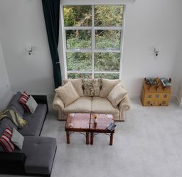 A living room with a couch and coffee table at Narracott Down South Molton
