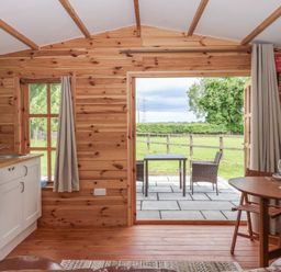 A kitchen with a view of the outdoor patio at Lodge 1 in Strensall