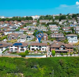 Aerial view of residential area with houses and gardens at Newquay Tamarisk Lodge on the Gannel in Newquay