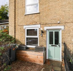An entrance with a green door and window at 5 Prospect Place in Woodbridge