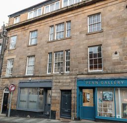 A street view of a building with two storefronts including penn gallery and multiple windows Upper Oakwood Alnwick