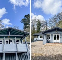 A grey wooden cabin with a porch and gravel driveway surrounded by trees at Valley Lodge in Oakfordbridge near Bampton