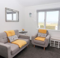 A living room with two sofas and a view of the outside at Bonny Bay in Wilsthorpe near Bridlington