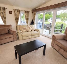 A living room with sofas and a coffee table at 41, Grandma's Cottage near Carnforth
