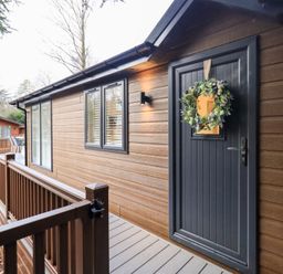 An entrance with a door and wreath at Unique Luxury Lodge, 1 Langdale, White Cross Bay near Windermere