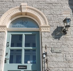 The front door of Stockham House with the number 49 above it on a stone building at 49 Esplanade Burnham-On-Sea
