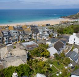 A coastal village with houses a beach and the ocean in the background at Ayr Farmhouse in St Ives