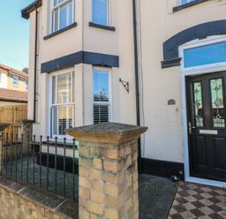A front entrance with a door and window at Sunrise House in Pakefield near Lowestoft