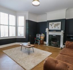 A living room with a sofa and a coffee table at Sunrise House Pakefield near Lowestoft
