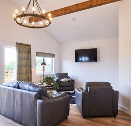 A living room with seating area and television at Monks Rest in Monknash