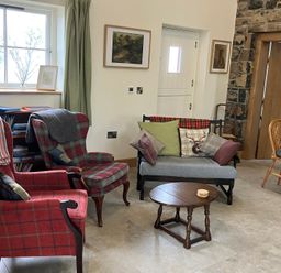 A living room with armchairs and a sofa at The Croft near Newtown-Crommelin