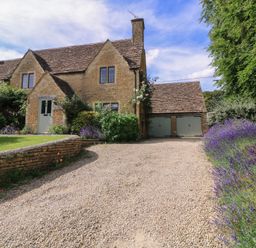 A house with a garage and garden at The Old Hall in Westonbit Nr Tetbury