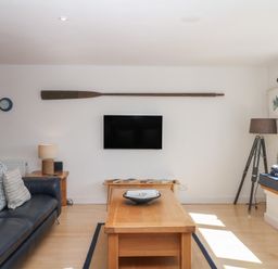 A living room with a sofa and coffee table at 4 Burgh Island Causeway in Bigbury