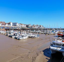 A marina with boats and buildings at Apt 6 @ Hunter's Quay Bridlington