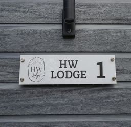A sign indicating HW Lodge 1 at Heather William Lodge near Woodhall Spa