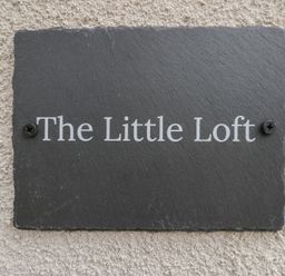 A sign for The Little Loft in Burford