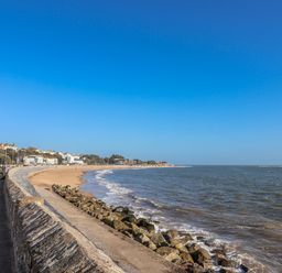 A beach view with a path and buildings at Sea Lovers Exmouth