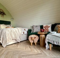 A living room with a bed and sofa at Willow in Llangurig near Llanidloes