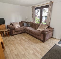 A living room with a sofa and television at Tolroy Manor Holiday Park St Erth Praze near Hayle