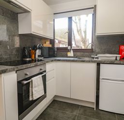 A kitchen with appliances and countertops at Tolroy Manor Holiday Park in St Erth Praze near Hayle