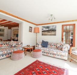 A living room with sofas and a coffee table at Temple House in Goonhavern