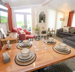 A dining area with a table and chairs at Plot 32 High Hesket near Armathwaite