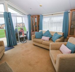 A living room with seating and a view at Gentle Tide Hasguard Cross near Little Haven