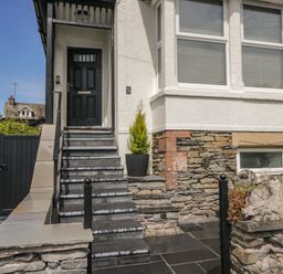 An outdoor entrance with steps and a door at 5 Thornbarrow Road
