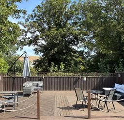 An outdoor area with seating and plants at The Swanage Rail Lookout in Swanage
