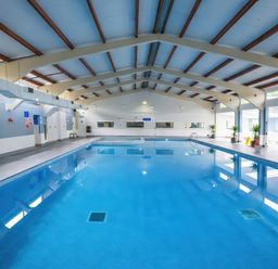An indoor pool area with a swimming pool at Chalet 58 - The Beach House Kingsdown