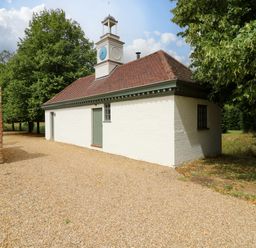 An outdoor area with a building featuring a clock tower at Clock Tower in Stowmarket