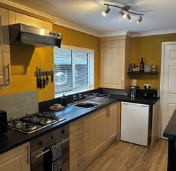 A kitchen with countertop and appliances at 22 Two Little Ducks, Lynton