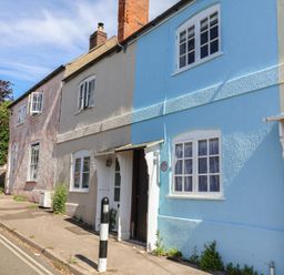 A house with blue and grey walls on a street at 6 Bedford Place Bridport