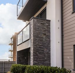 Exterior of a modern building with balconies and glass railings at 7 Warren Edge Close in Bournemouth