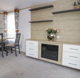 A dining room with a table and chairs at Ash in Denny