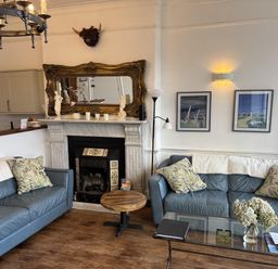 A living room with two sofas and a coffee table at Bayview Tower in Lynton