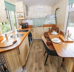 A kitchen with a sink and stove at The Hamper in Felingwm near Carmarthen