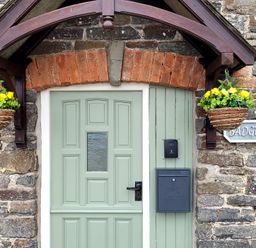 A front door and mailbox at Badgers Sett in Stibb near Kilkhampton