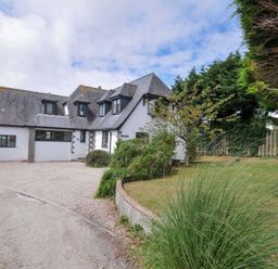 A house with a garden and pathway at Seaworthy in Daymer Bay