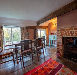 A dining room with a table and chairs at 5 St. Michaels Close in Framlingham