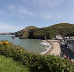 A beach with houses and hills at Brynmorfa in Llandysul