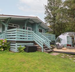 A house with a deck and outdoor seating at Scarba in Oban