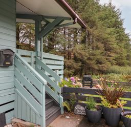 An exterior view of stairs and planters at Scarba in Oban