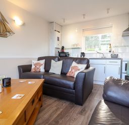 A living room with a sofa and coffee table at Castle View Lodge Ilfracombe